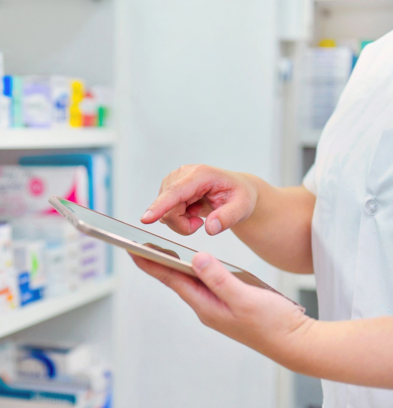 Pharmacist using a tablet during a consultation