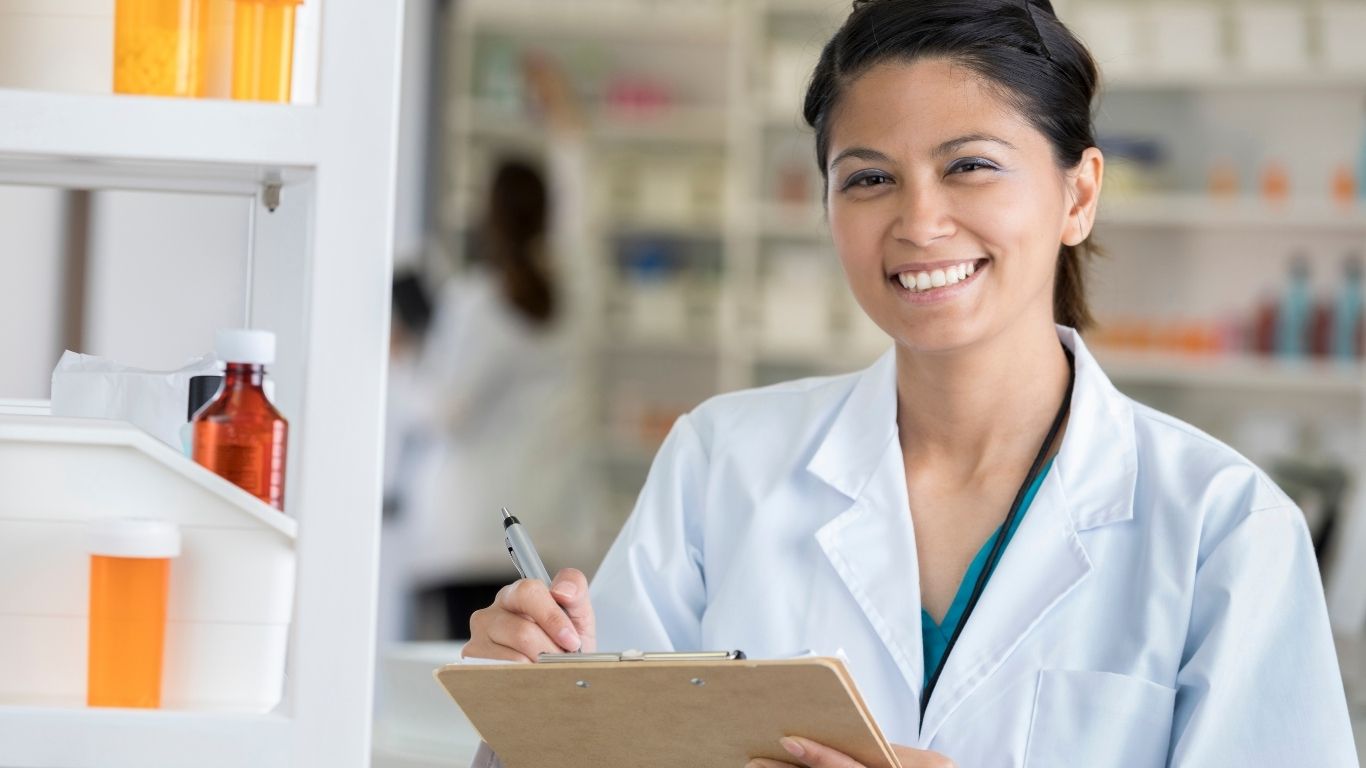 Pharmacist reviewing a patient's details
