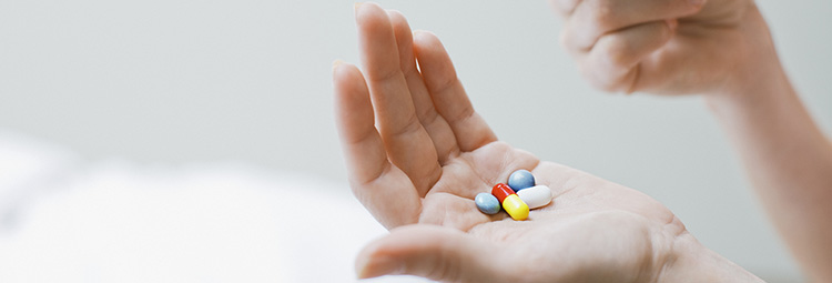 Woman taking vitamins and supplements